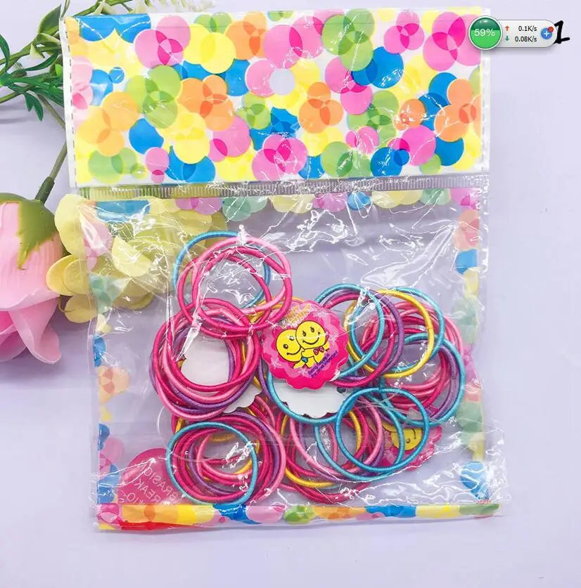 A lot of 50 PCS Hair Rubber Band, 3 CM in Diameter (a little more than one inch).